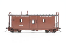 Load image into Gallery viewer, HO Brass OMI - Overland Models, Inc. NP - Northern Pacific Wood Bay Window Caboose #10506-10594 Pro-Painted No. 1594