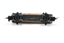 Load image into Gallery viewer, HOn3 Micro-Trains Various Roads 30’ Skeleton Log Car With Load