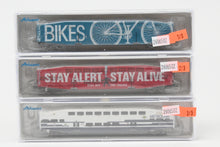 Load image into Gallery viewer, N Athearn Metrolink Bombardier Coach 3-Pack Special Edition "Bikes" and "Stay Alert Stay Alive" Cars - MISSING OUTER SLEEVE
