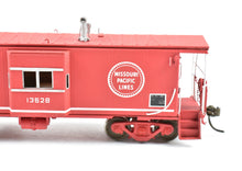 Load image into Gallery viewer, HO Brass OMI - Overland Models, Inc. WP - Western Pacific Bay Window Caboose Painted For Missouri Pacific
